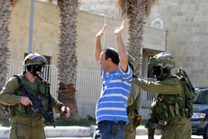 Masked soldiers arresting university personnel